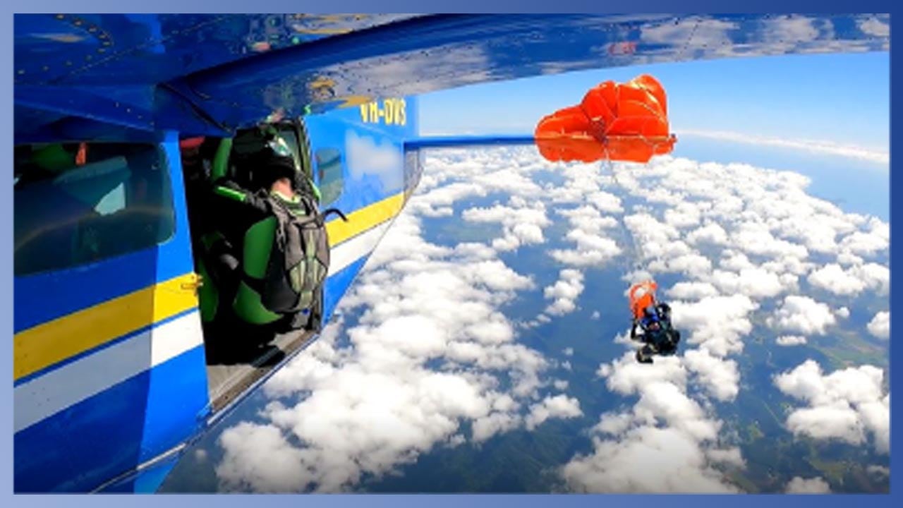 Skydiver caught on plane's tail.