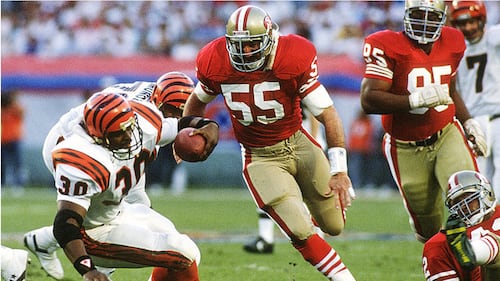 The San Francisco 49ers linebacker (55) closes in on Ickey Woods during Super Bowl XXIV.