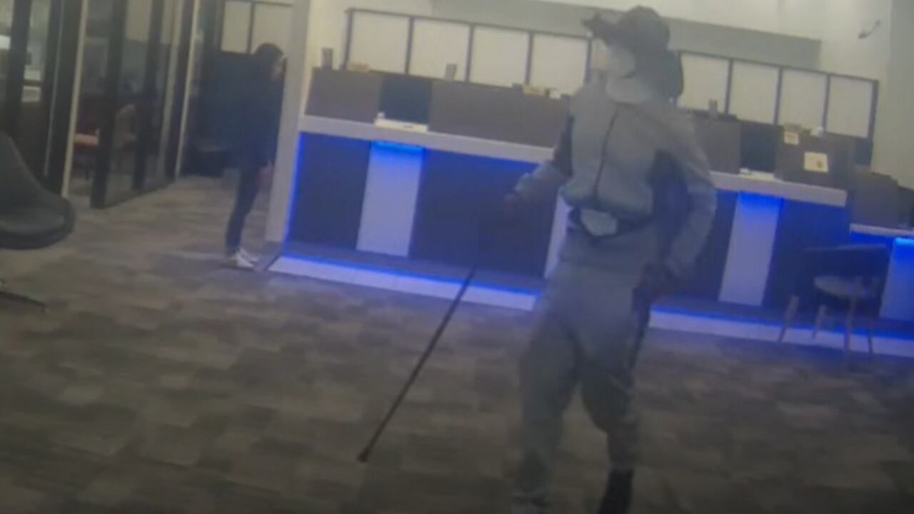 The man came into the bank wearing a neck brace and using a cane before demanding money from a teller.