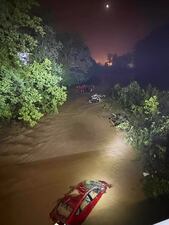 In this image provided by the Wheeling West Virginia Fire Department, cars sit submerged in floodwaters, Saturday, June 14, 2025, in Wheeling, W.V. (Wheeling West Virginia Fire Department via AP)