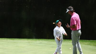 AUGUSTA, GEORGIA - APRIL 10: Bubba Watson of the United States and his daughter celebrate on the ninth green during the Par Three Contest prior to the 2024 Masters Tournament at Augusta National Golf Club on April 10, 2024 in Augusta, Georgia. (Photo by Maddie Meyer/Getty Images)