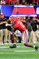 Georgia running back Kendall Milton (2) rushes for a 12-yard touchdown against Oregon  in the 2022 Chick-fil-a Kickoff Game played September 3rd in Atlanta, GA, at Mercedes-Benz Stadium. Photo credit Perry McIntyre.